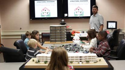 Children engaged in a classroom science activity.