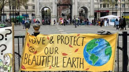 Earth banner at Marble Arch, Park Lane, London.