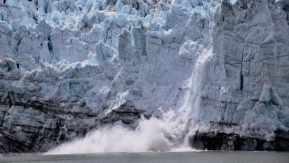 A glacier calving.