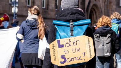 "Listen to the science" poster