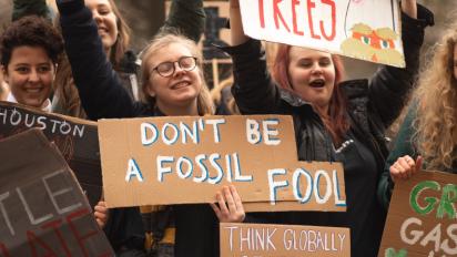 Climate activitists holding signs.