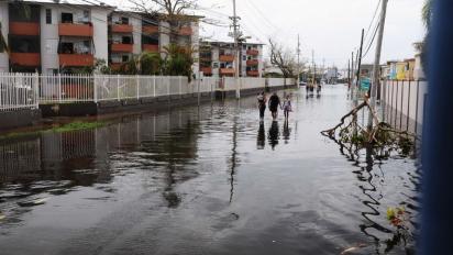 Puerto Rican residents walk in flooded streets in Condado, San Juan, Puerto Rico, Sept. 22, 2017, following Hurricane Maria. Puerto Rico National Guard photo by Sgt. Jose Ahiram Diaz-Ramos.