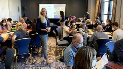 NCSE Teacher Ambassador Chandler Tawney presents a lesson at the Evolution Symposium.