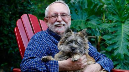 Michael Ruse with his pet, McGruff, in 2020.