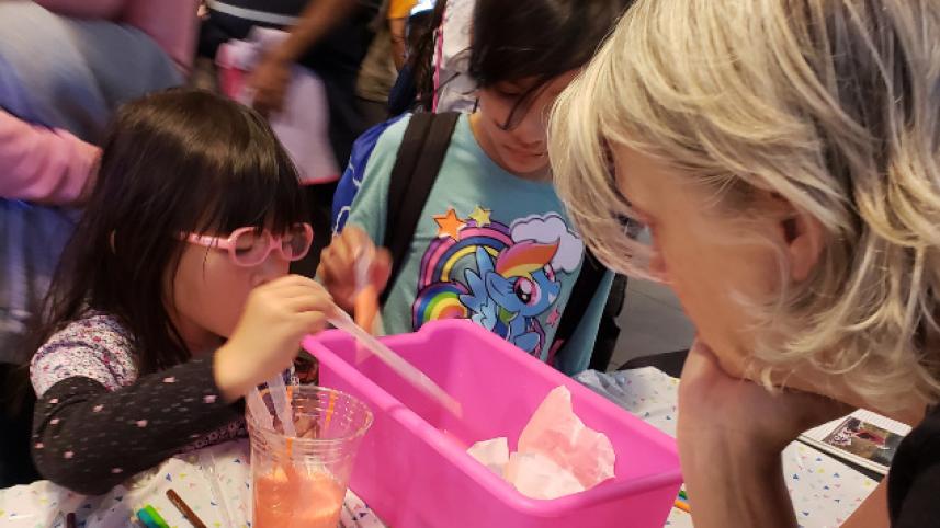 Young girl engaging in a science activity
