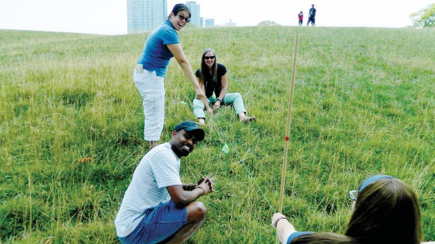 Teachers measuring sea level.
