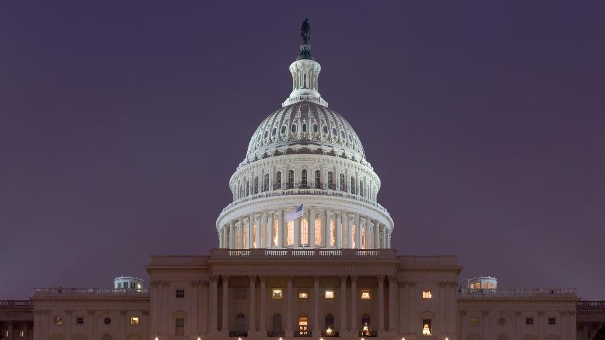 The United States Capitol at night.